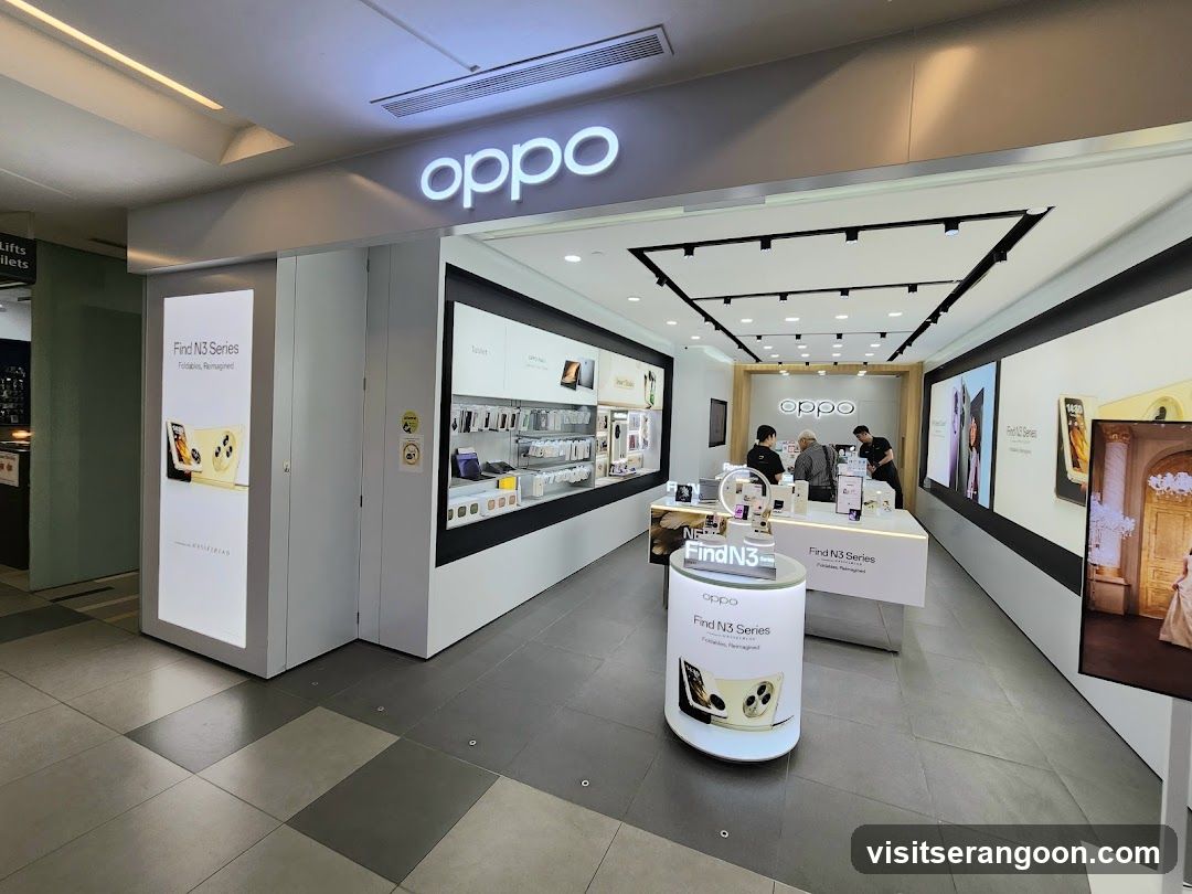 A brightly lit retail store entrance with a large, illuminated 'oppo' sign above the doorway. The interior features white display counters, wall-mounted product showcases, and promotional posters for the 'Find N3 Series'. Several customers and staff are visible inside the store.