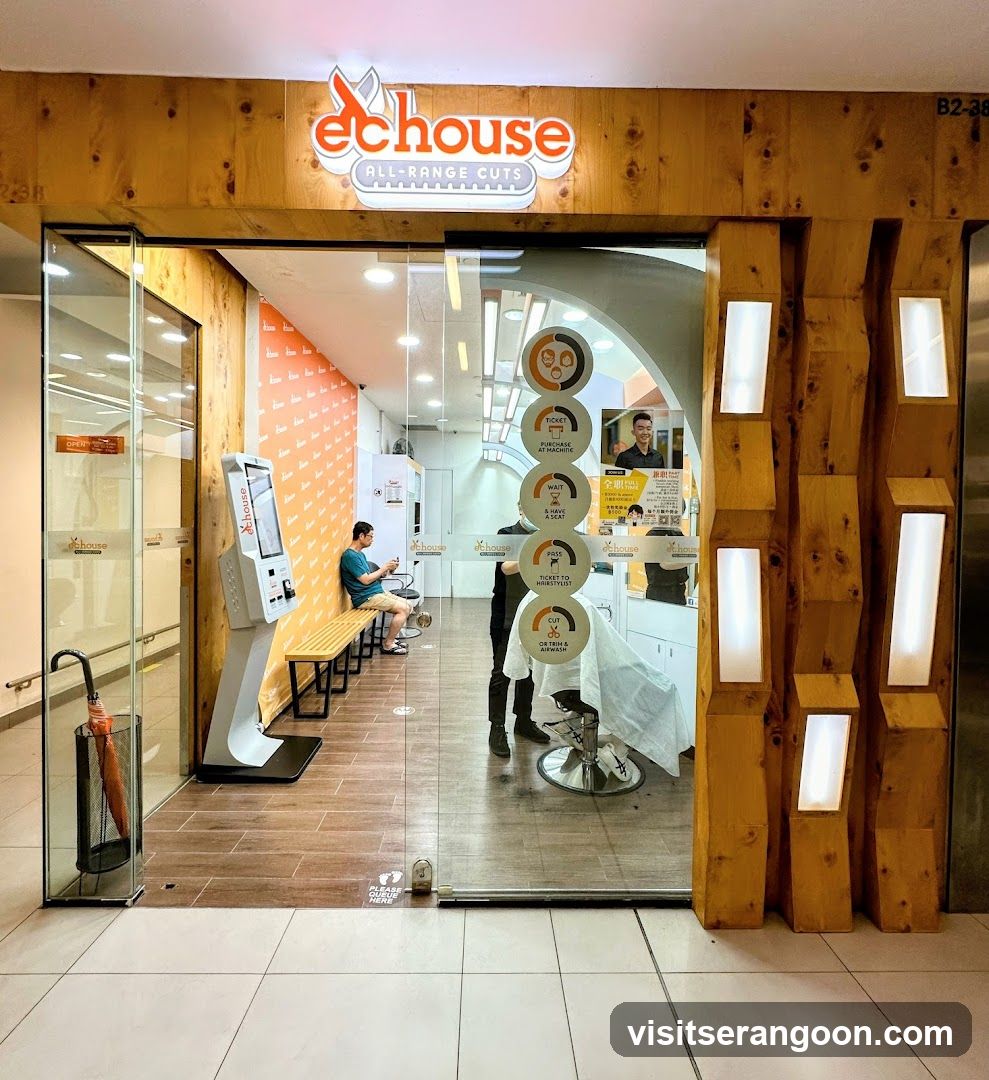 A storefront with a wooden facade and glass entrance doors. The sign above reads 'dchouse ALL-RANGE CUTS'. Inside, a customer sits on a bench while a barber works on another client. A vertical display of circular icons is visible on the glass.