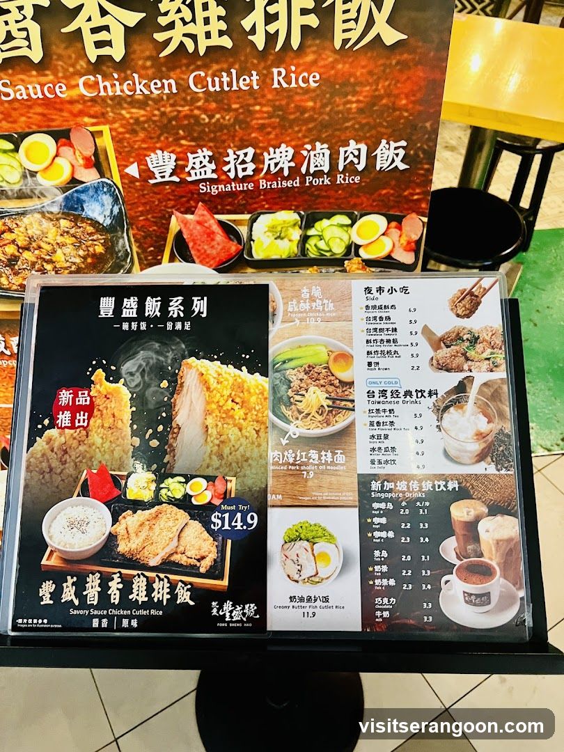 A black menu stand displaying a laminated menu for a restaurant. The menu features a large promotional image for 'Savory Sauce Chicken Cutlet Rice' priced at $14.9, alongside sections for 'Signature Braised Pork Rice', 'Taiwan Noodles', and various drinks.