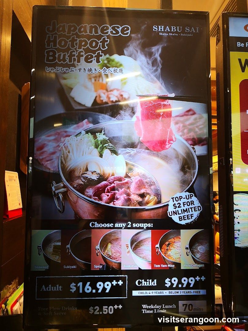 A vertical digital menu board advertising a Japanese Hotpot Buffet at Shabu Sai. The board features images of the hotpot, soup options, and pricing details for adults and children.