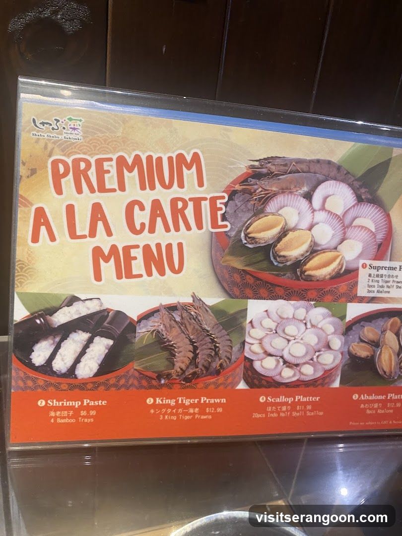 A laminated menu board displaying four seafood dishes with photos and pricing.