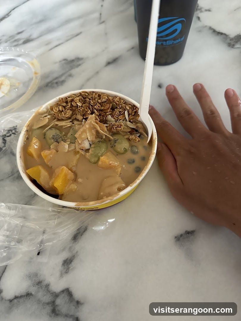 Bowl of Mango Pudding with Granola and Coconut