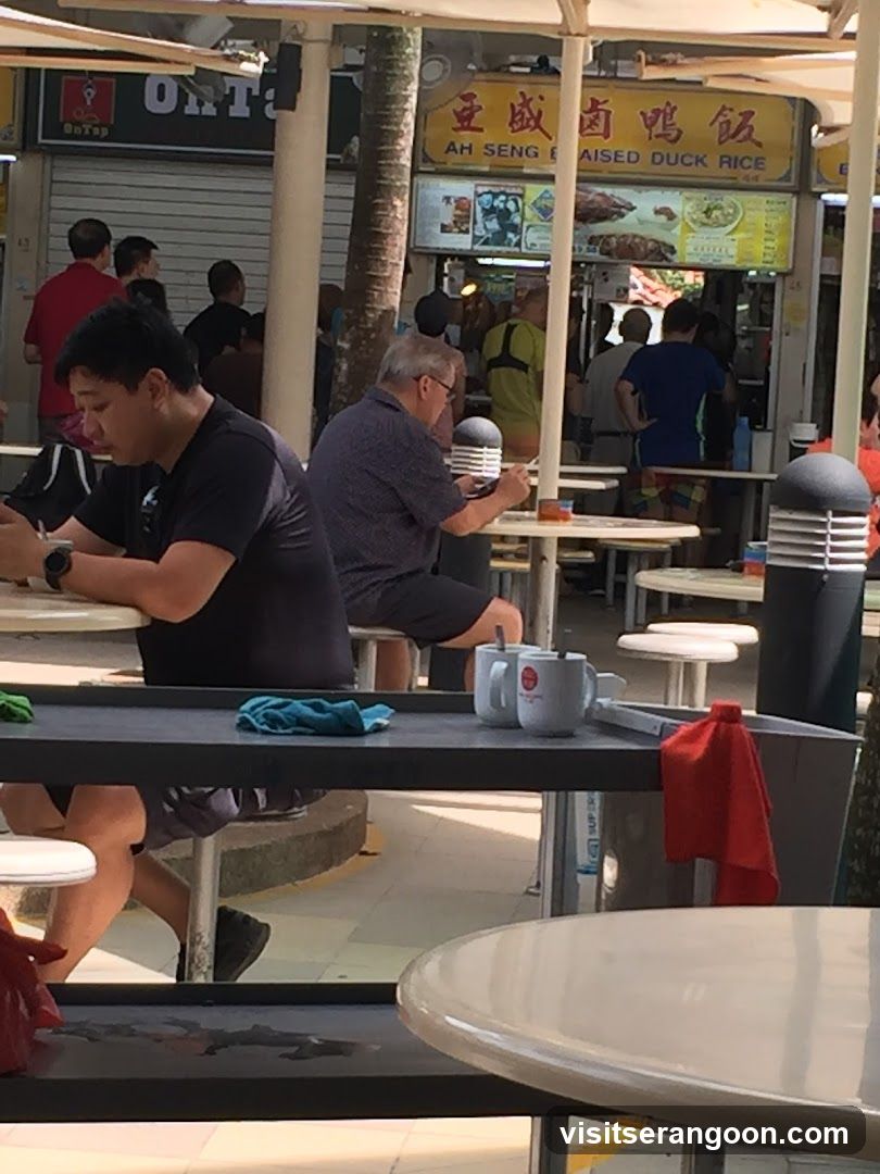 People eating at a food stall