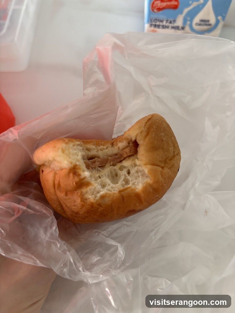 Bite taken out of a filled bun