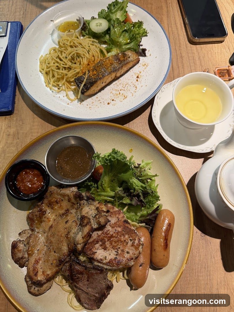 Two plates of food with a cup of tea