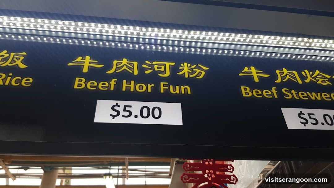 A menu board with illuminated text displaying food items and prices.