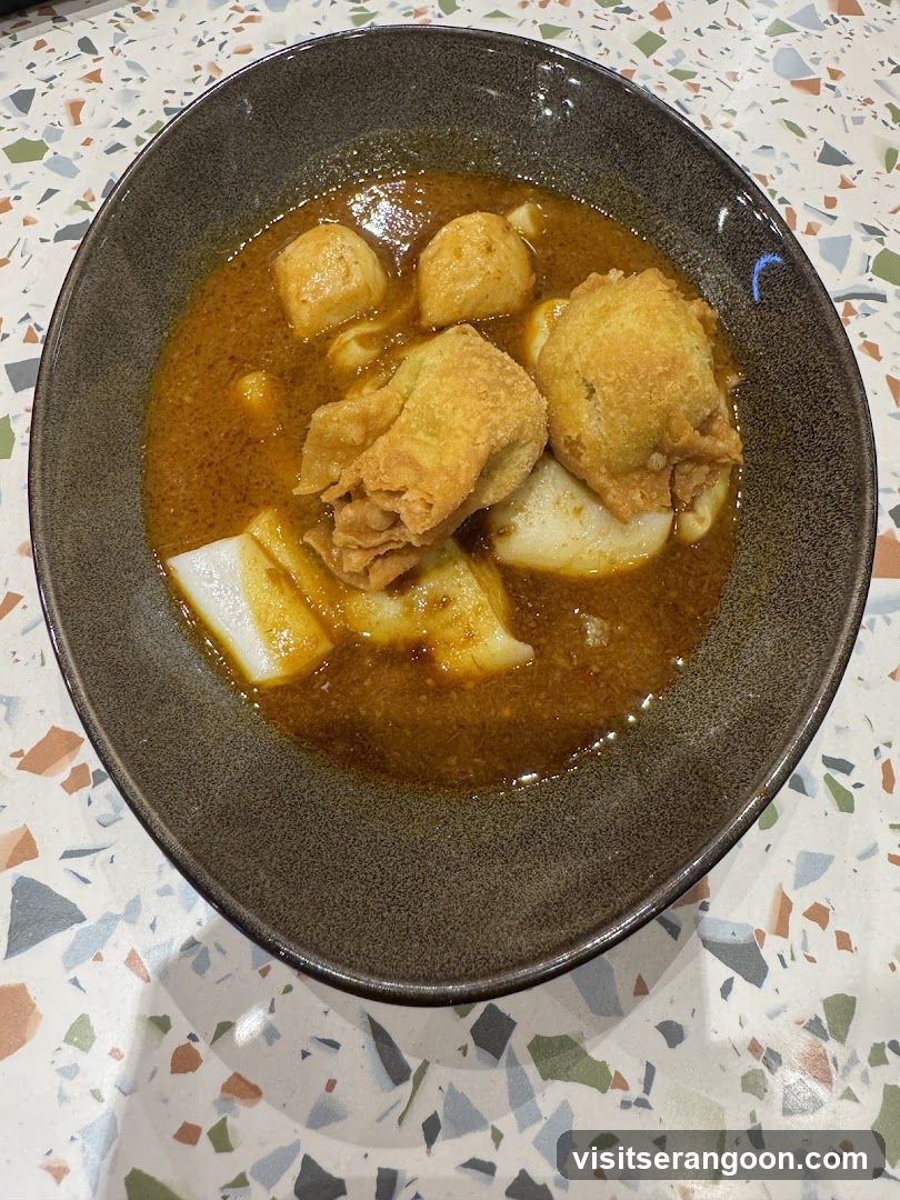 Curry Noodles with Fried Wontons and Fish Balls