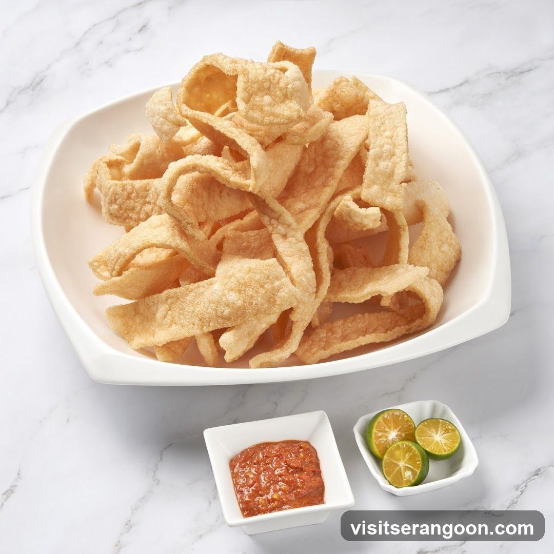 Crispy Pork Rinds with Chili Dip and Lime Wedges