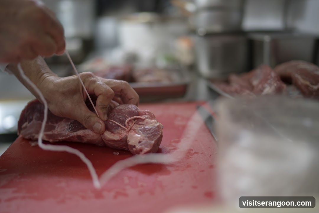 Butcher Tying Meat