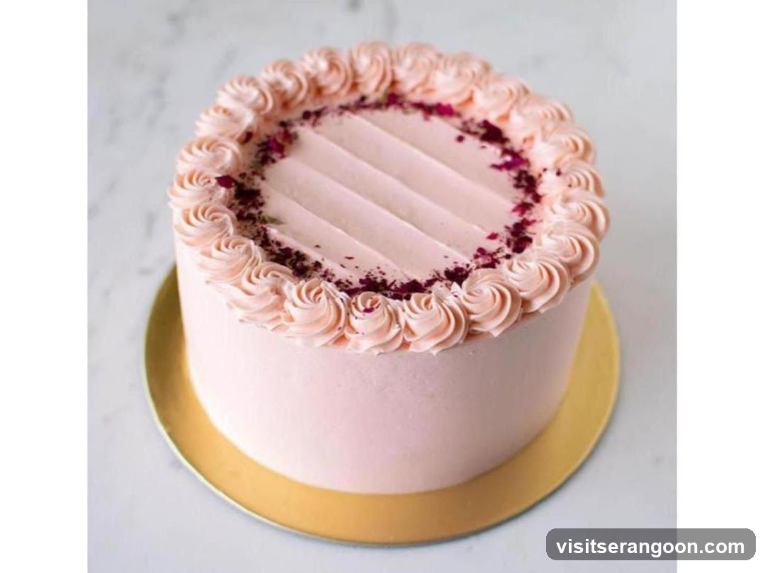 Pink Frosted Cake with Rose Swirls