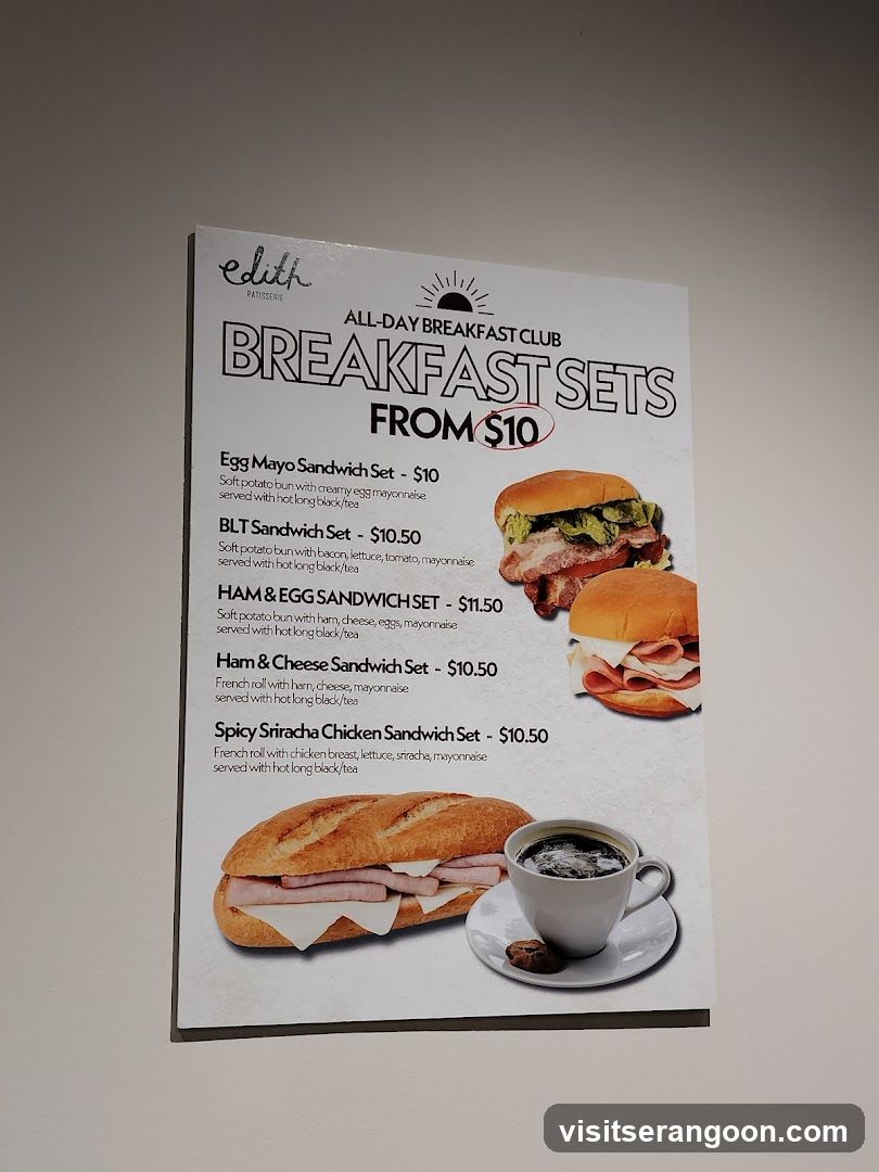 A menu board for Edith Patisserie's All-Day Breakfast Club, featuring various sandwich sets.