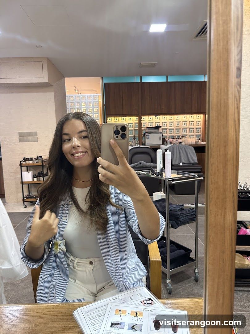 Woman taking a selfie in a salon