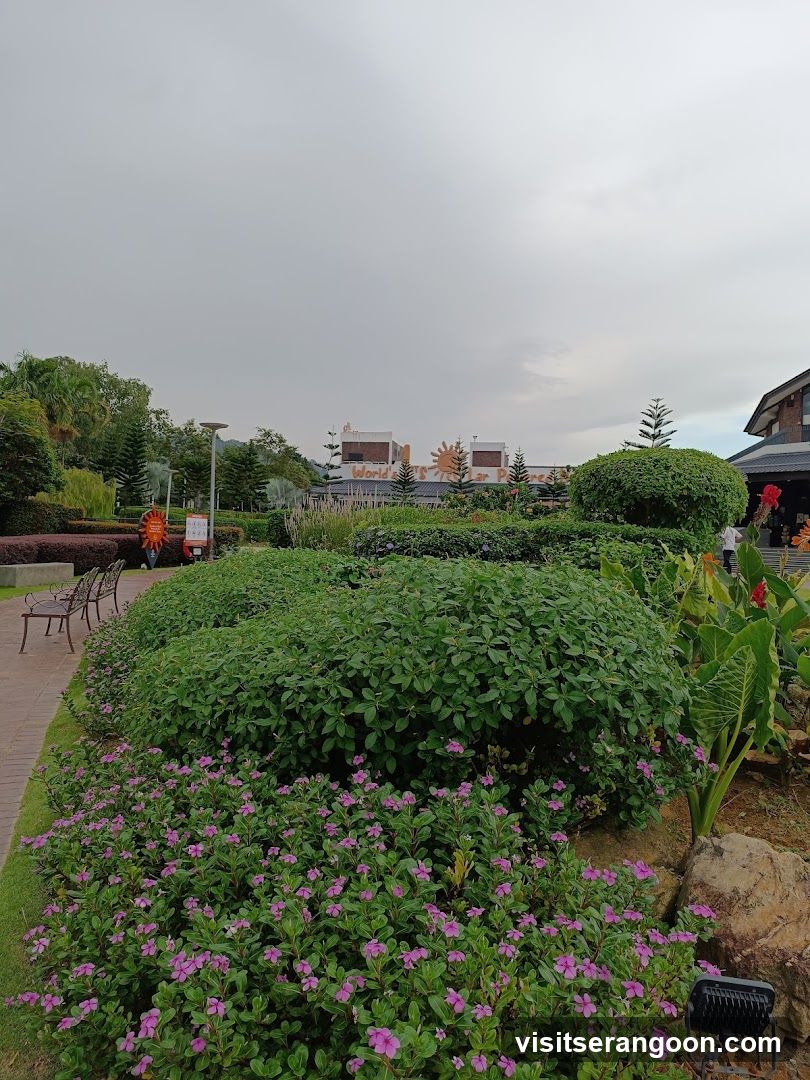 Landscaped Garden with Buildings in Background