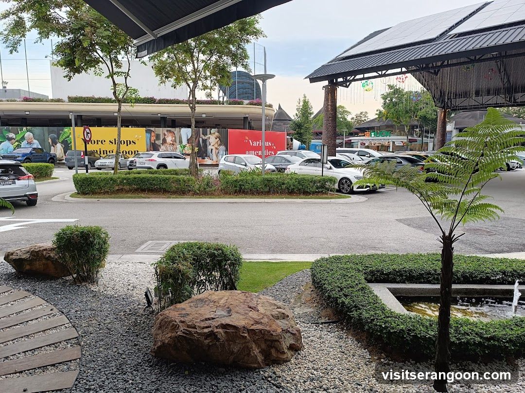 Outdoor shopping area with parking and landscaping
