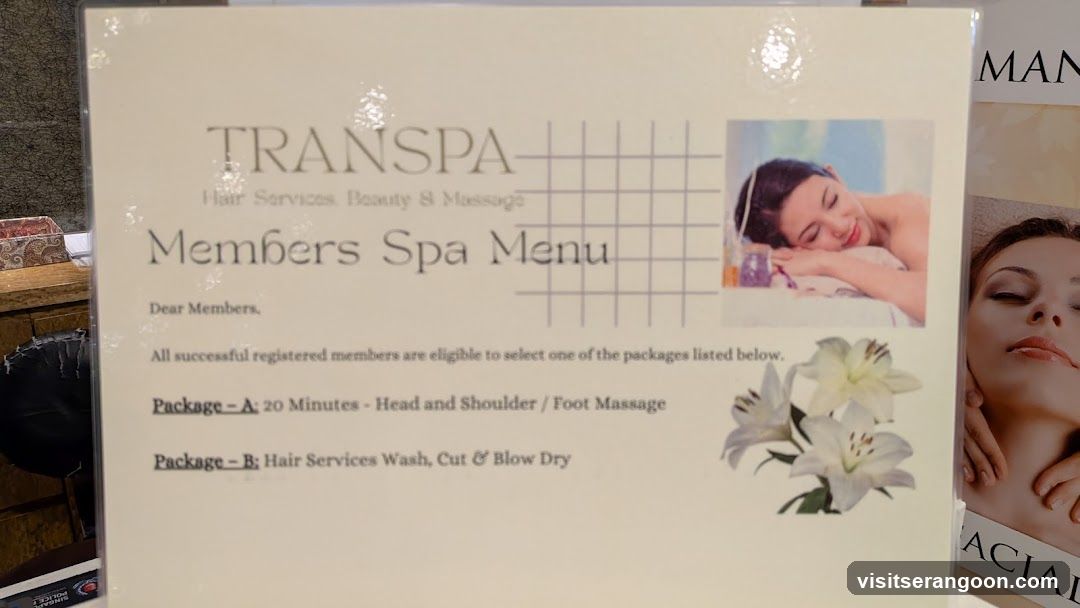 A printed menu board displaying spa services and packages.