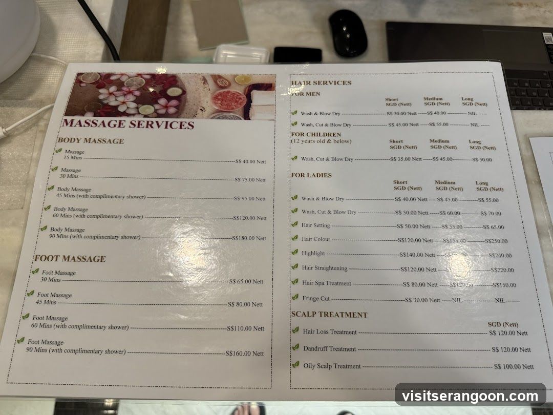 A printed menu displaying massage and hair services with prices in SGD, including body massages, foot massages, children's services, ladies' hair treatments, and scalp treatments.