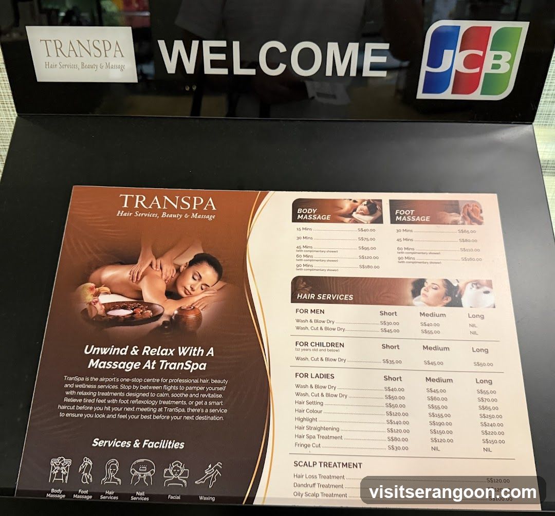 A printed menu board displaying services and prices at Transpa salon. Includes body massage (15-60 mins), foot massage (30-90 mins), hair services for men/children/ladies (short/medium/long cuts, coloring, straightening), scalp treatments, and a list of facilities like manicure, pedicure, facial, etc.