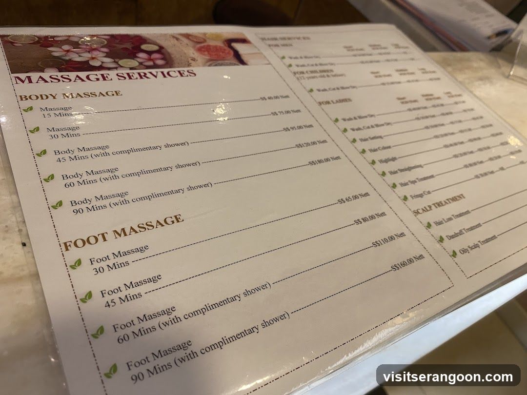 A printed menu displaying massage and spa services with prices in Thai Baht.