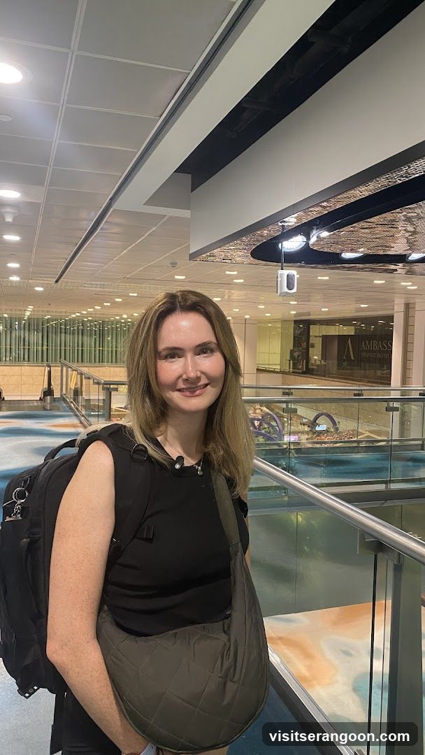 Woman with Backpack in Airport Terminal