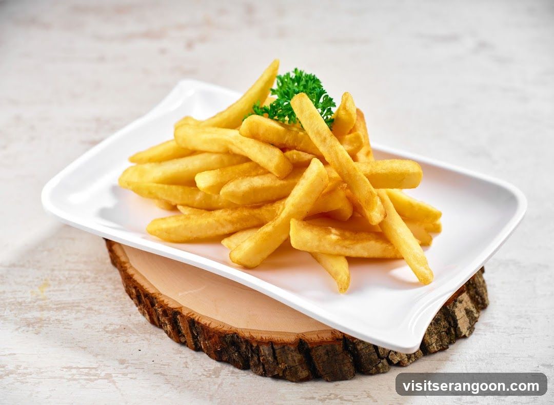 French Fries on a Wooden Slice