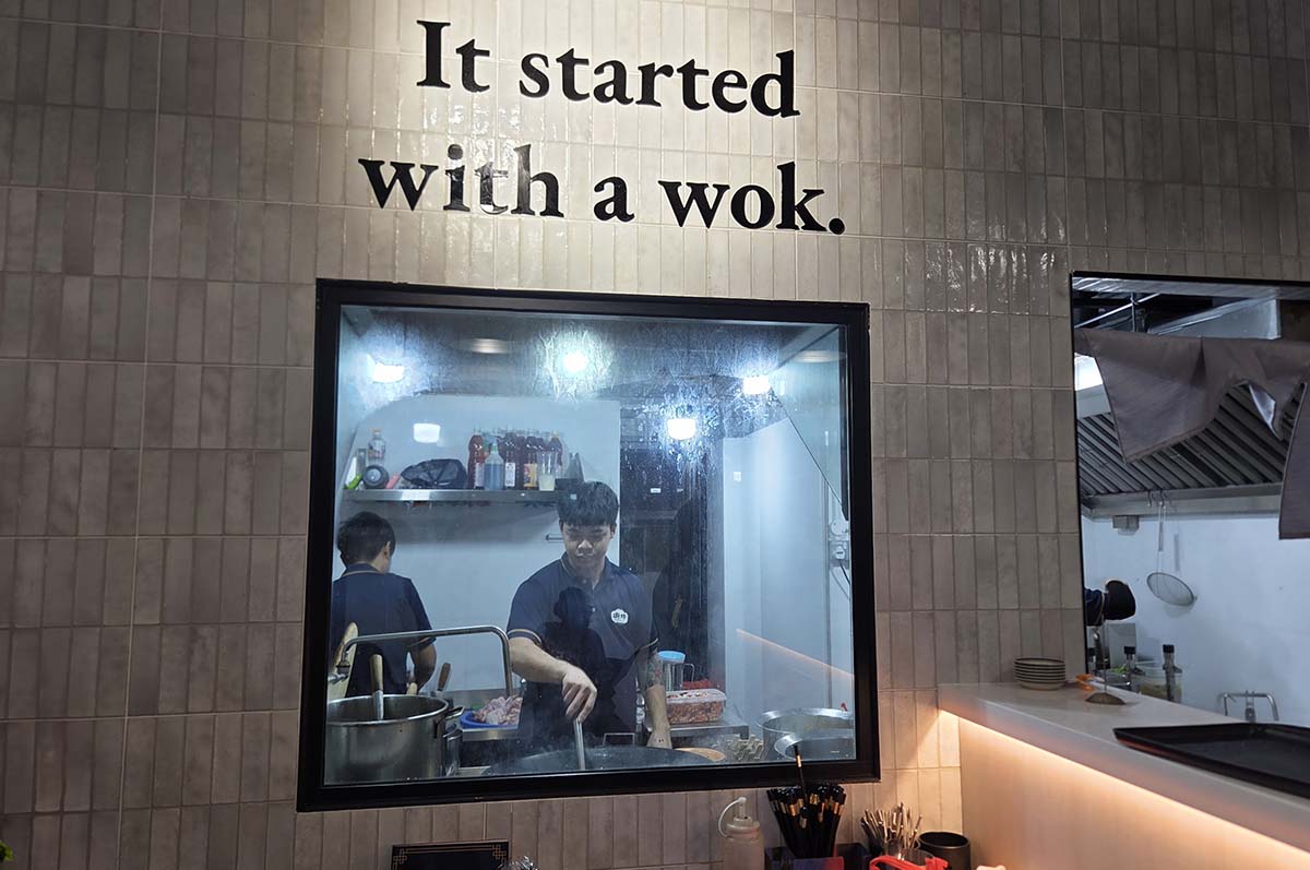 Glass window looking into the wok station at Wok and Toast, Serangoon Central Drive